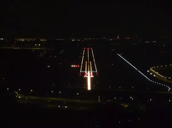 The view of the runway lights on approach for a night landing