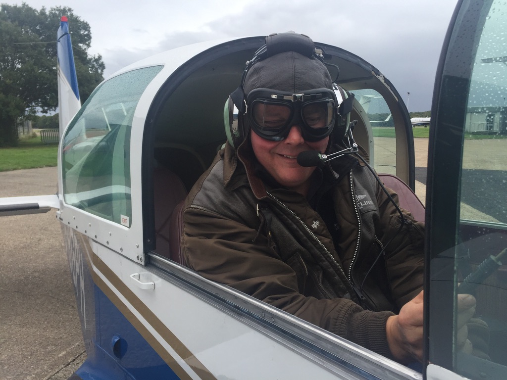 A student pilot waiting n the cockpit for a lesson