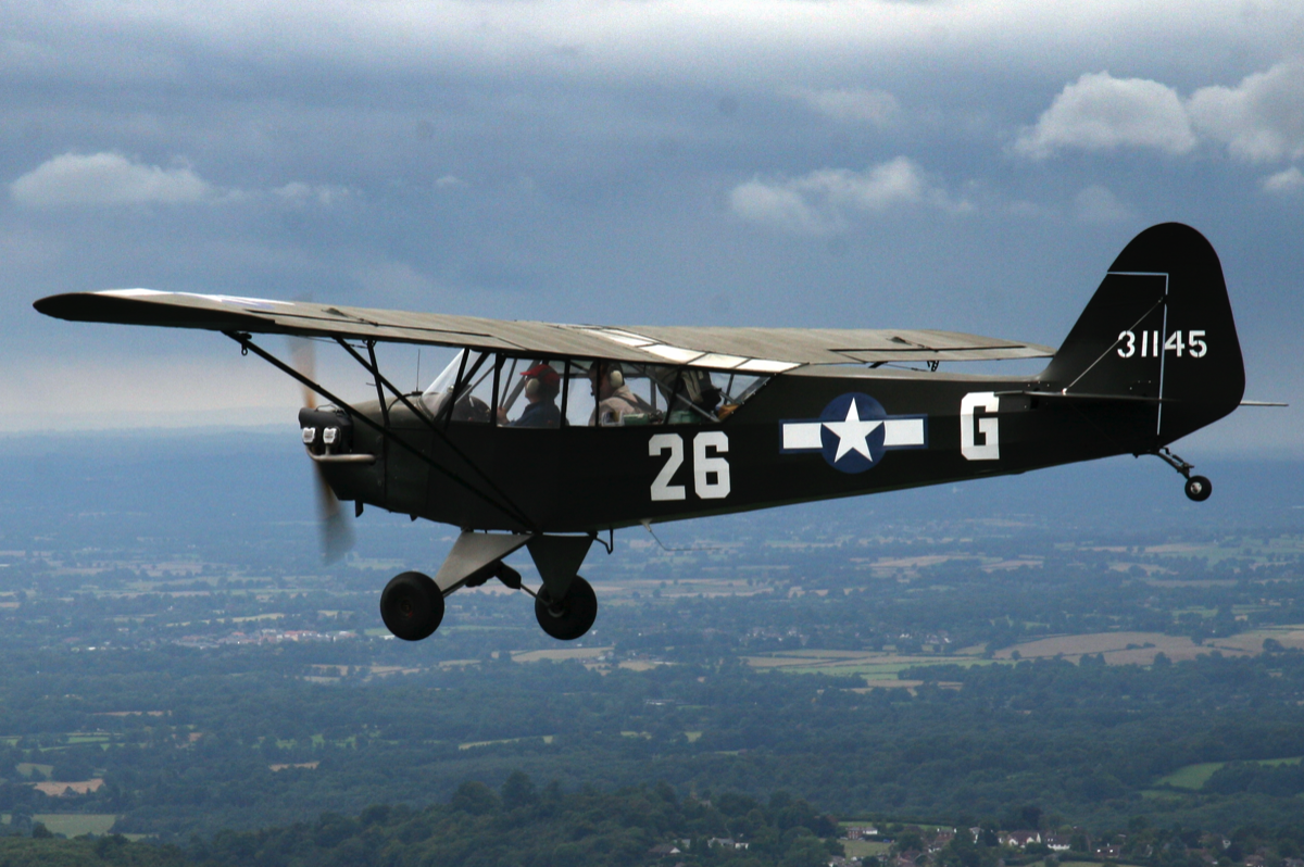 Our Piper L4 Cub aircraft flying over kent