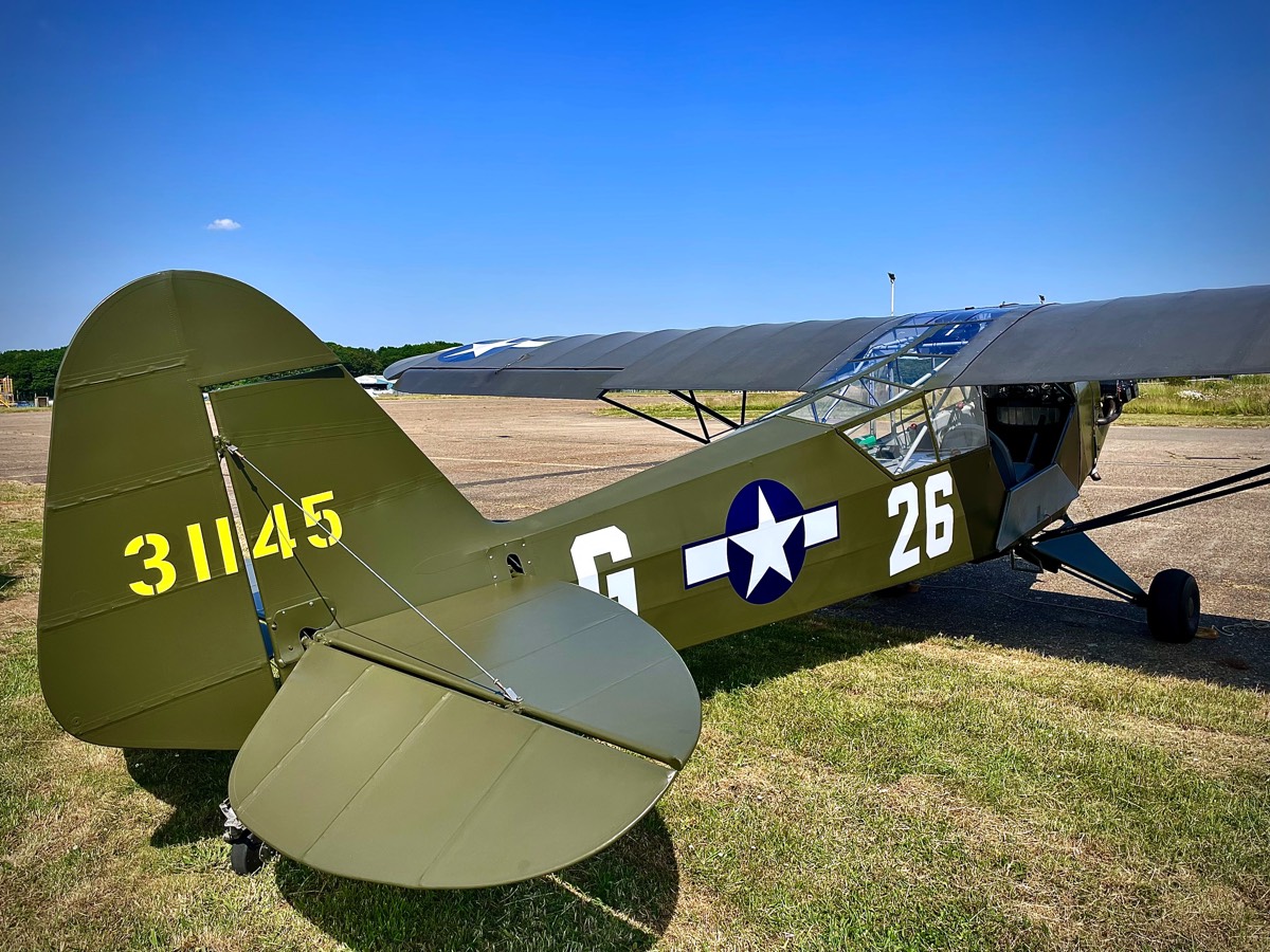 A tail view of our Piper L$ Cub aircraft